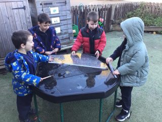 Reception have been exploring the ice outside. We experimented with different ways of melting it.