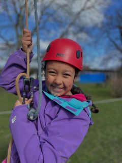 Happy smiles after whizzing down the zip line!